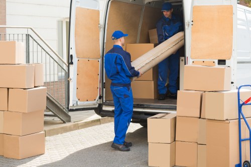 Furniture pick-up service in a Primrose Hill residential street with careful loading