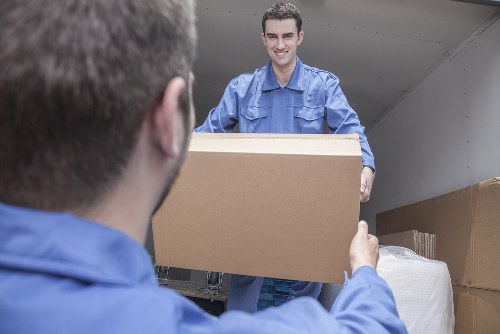 Man with van loading furniture in Primrose Hill