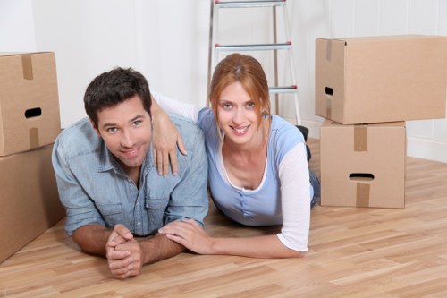 Packed moving boxes and furniture ready for transport in a Primrose Hill flat